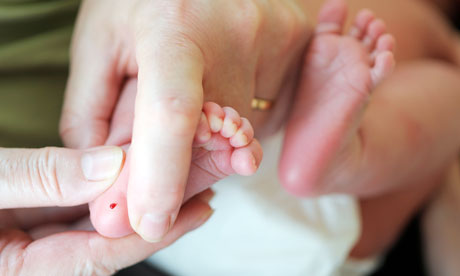 Newborn heel prick test baby